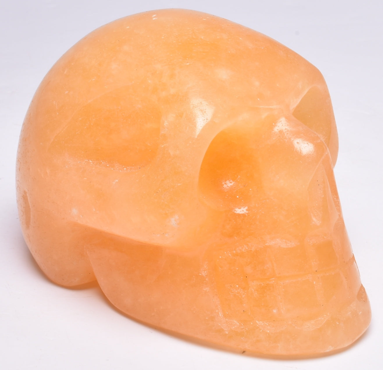 ORANGE CALCITE CRYSTAL CARVED SKULL P596