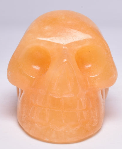 ORANGE CALCITE CRYSTAL CARVED SKULL P596