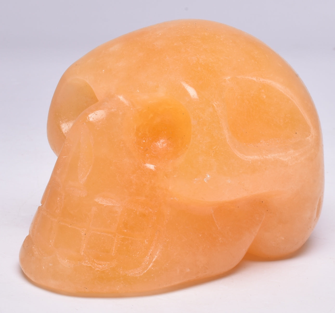 ORANGE CALCITE CRYSTAL CARVED SKULL P596