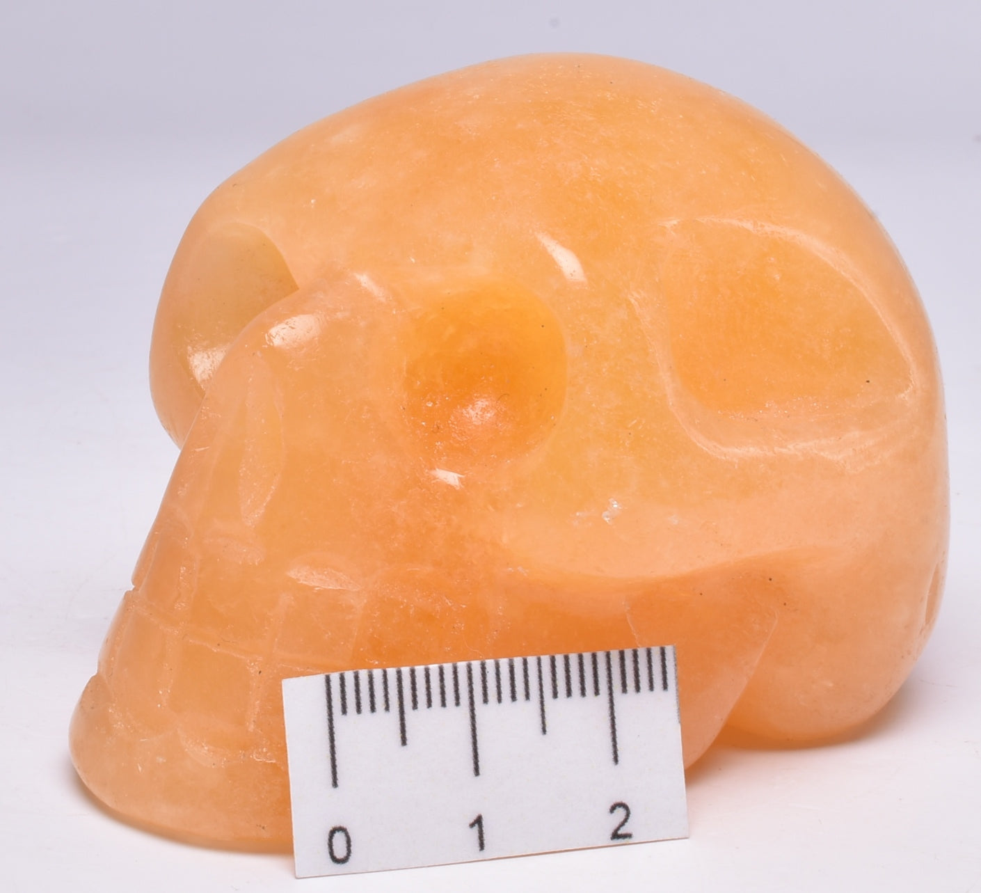 ORANGE CALCITE CRYSTAL CARVED SKULL P596