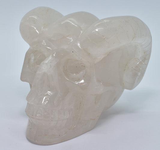 CARVED QUARTZ SKULL WITH RAM HORNS P458