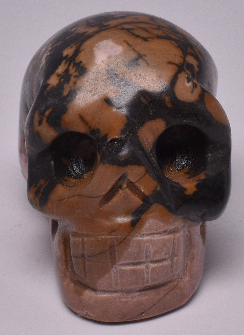 CRYSTAL RHODONITE CARVED SKULL P370