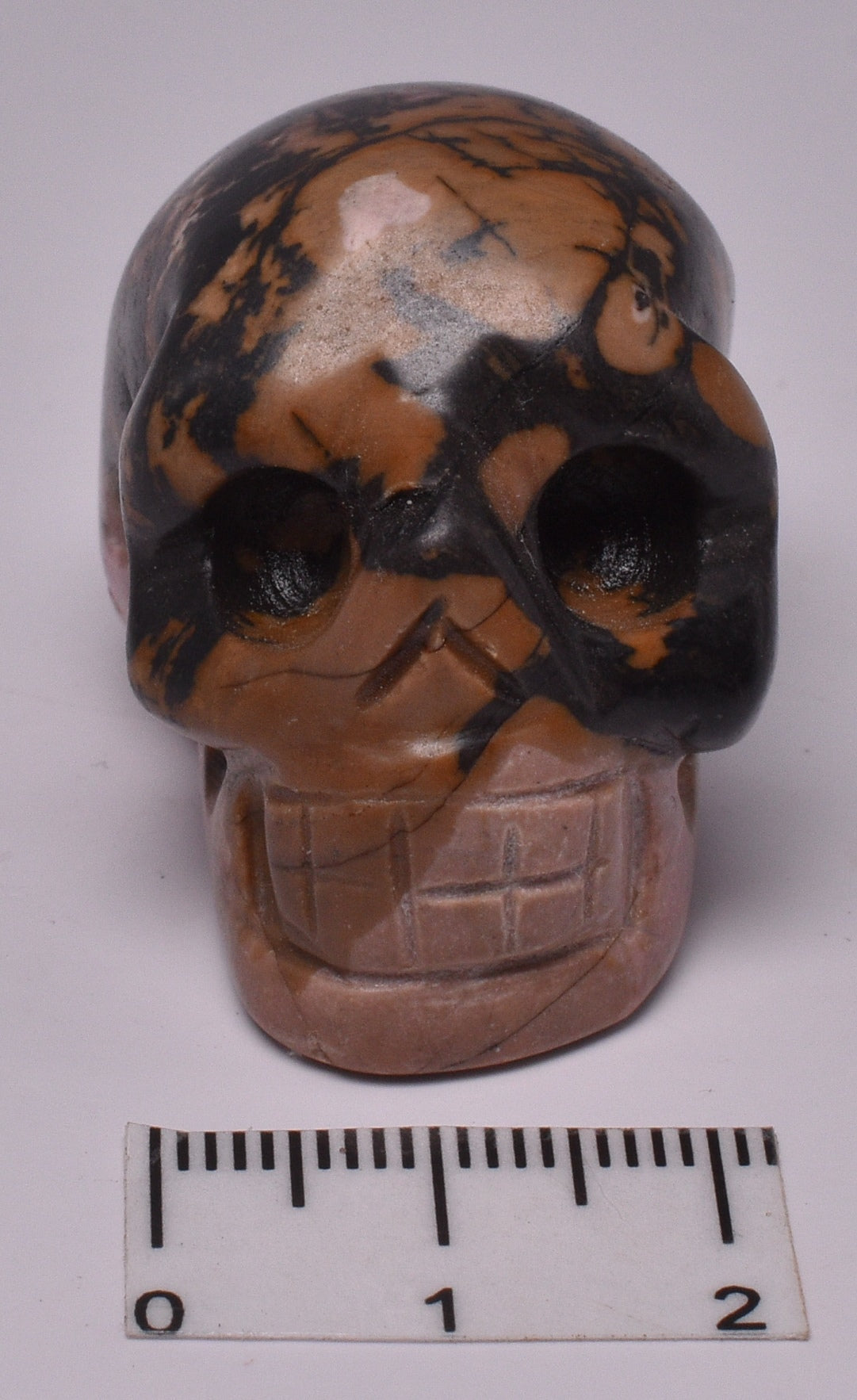 CRYSTAL RHODONITE CARVED SKULL P370